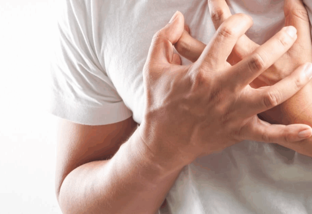 an image of man feeling aspirin chest tightness