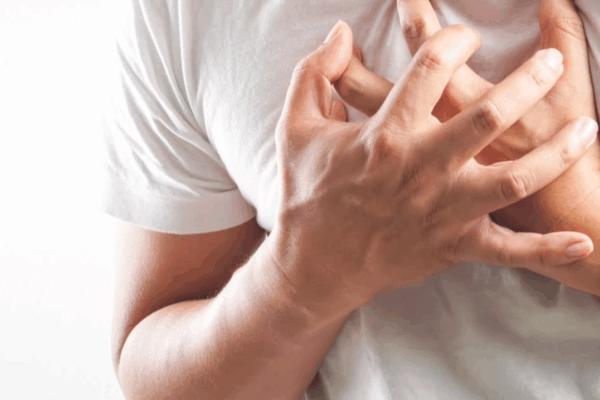 an image of man feeling aspirin chest tightness