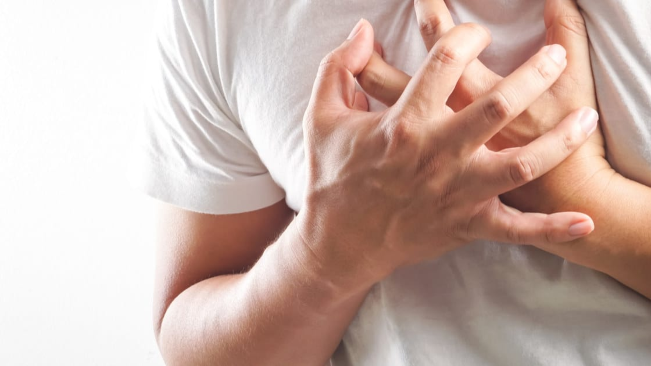 an image of man feeling aspirin chest tightness